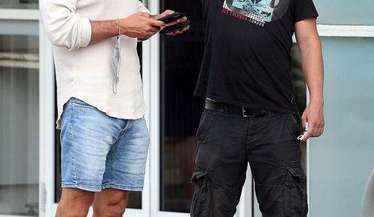 Melissa Caddick’s husband sports flash haircut and has drink with a mate at Bondi restaurant